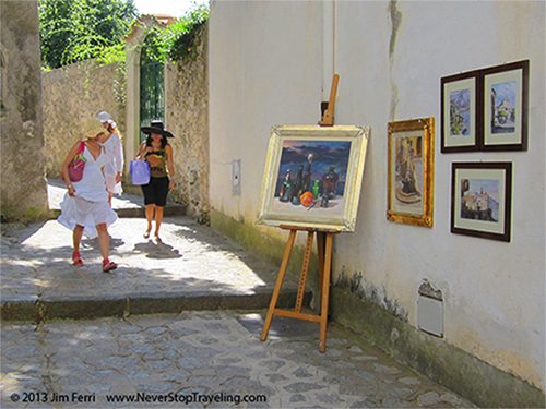 Foto Friday - women passing art on a builsing Ravello, Italy