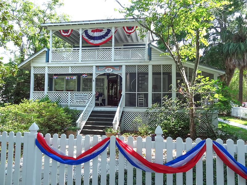 an old house with colorful bunting on the Golden Isles of Georgia