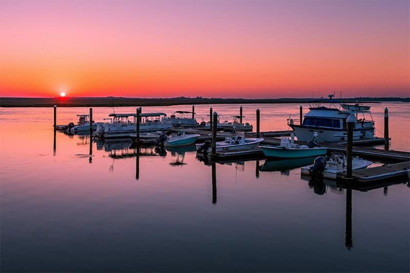 boats in a dock during a beautiful sunset