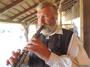 a man playing a clarinet seen on a Eastern Europe river cruise