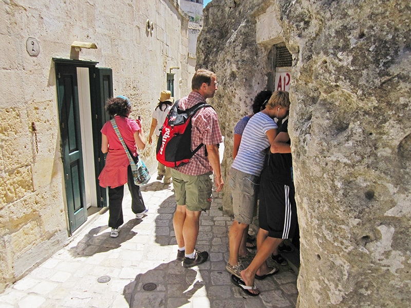 people looking into a Sassi cave