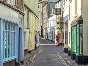 a winding street in Polperro  - one of the places to visit in cornwall