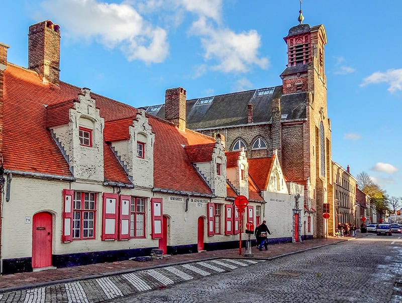 brightly painted buildings seen on a visit during one of the best times to visit Bruges