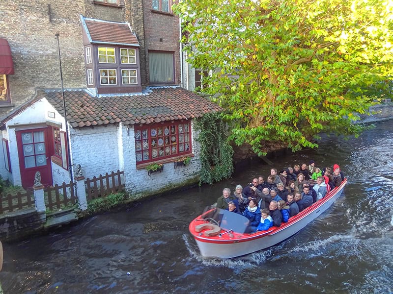 people in a boat on a canal tour