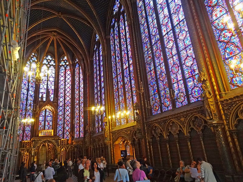 people looking at stained glass windows - walking tour of Paris