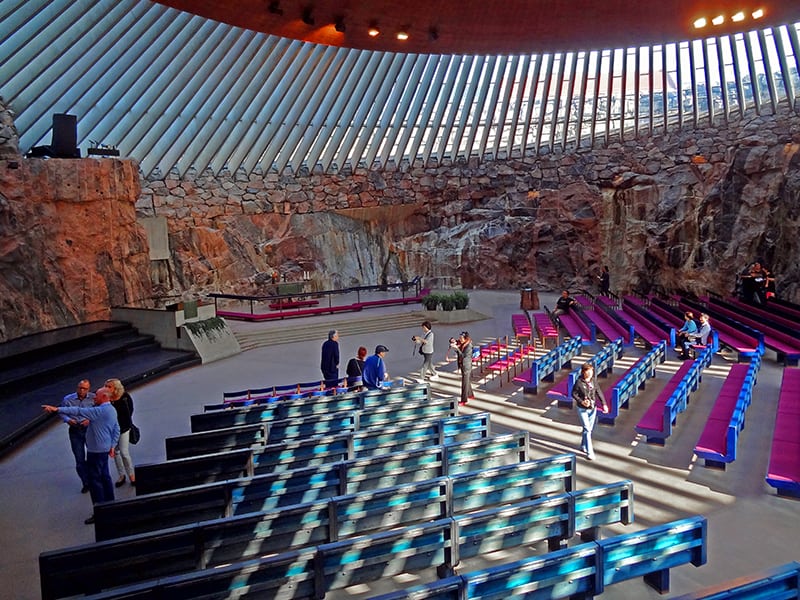 people visiting a very modern church, one of the most popular things to do in Helsinki