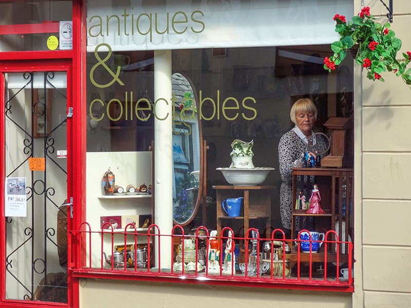 a woman in an antiques shop seen on the Northern Ireland Coast road