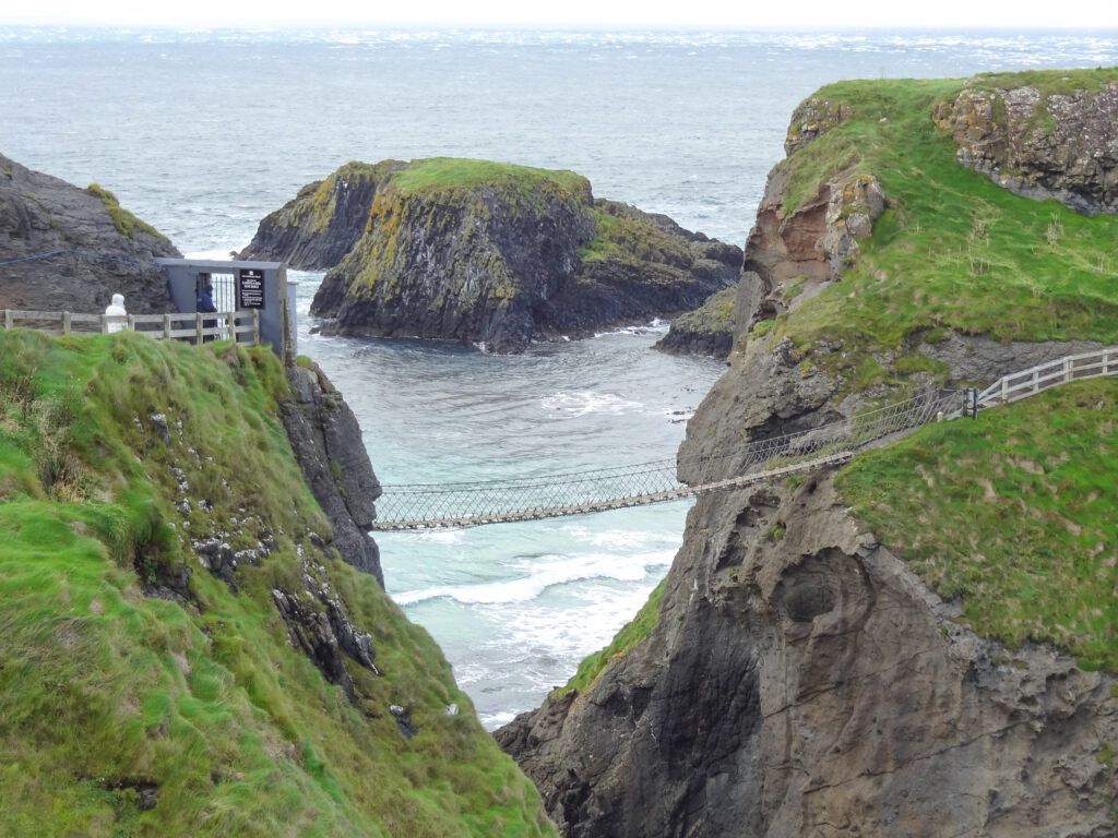 a rope bridge high above the sea