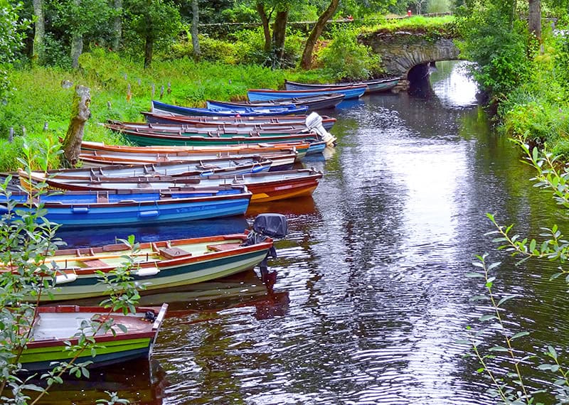 boats in a creek in Killarney National Park on the Ring of Kerry