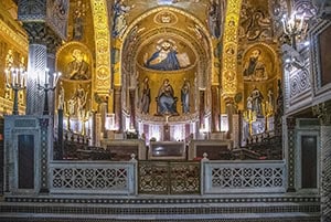 the ornate gold altar in an ancient cathedral