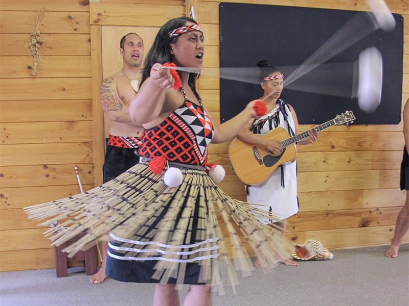 A Maori dancer and musicians on the Thermal Explorer Highway 