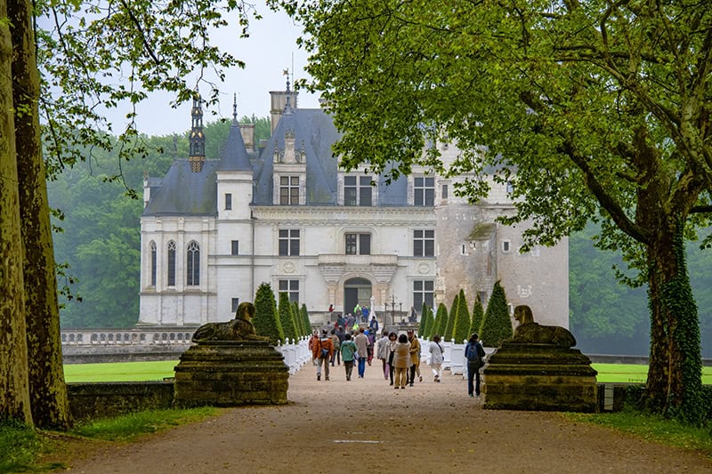 people walking towards the entrance of in a chateau in the Loire Valley