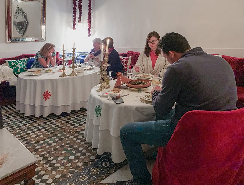 people sitting at tables in an upscale restaurant