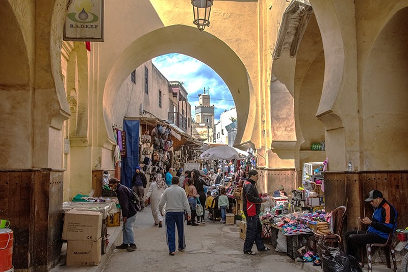 people in a crowded market in Fez Morocco