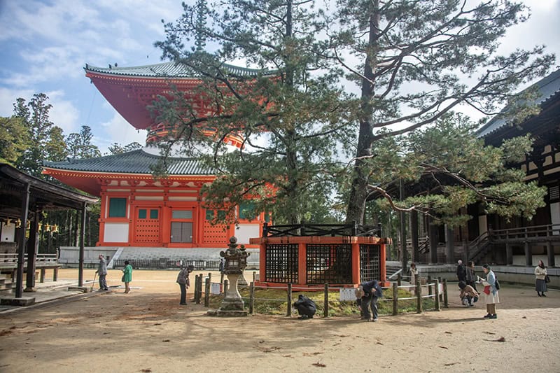 a large bright red pagoda in koyasan japan