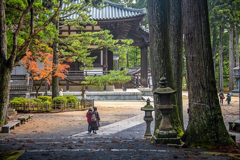 two women walking through an ancient town in Kayasan Japan