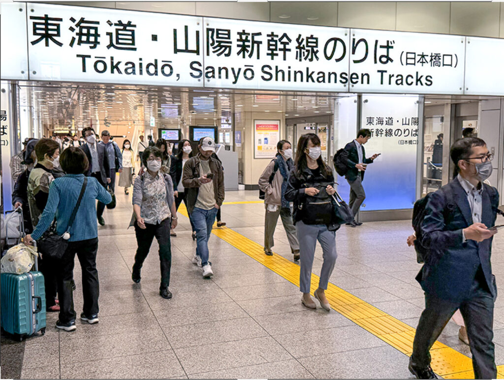 people in a Japanese train station