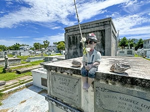 a tombstone showing a boy fishing