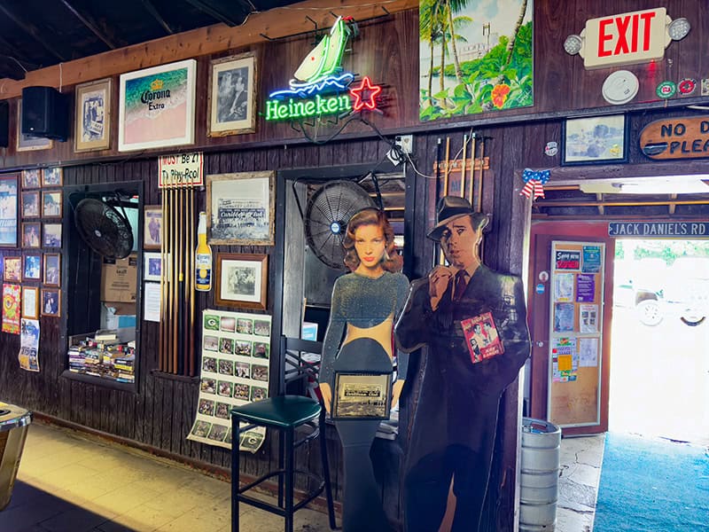 cut outs of movie stars Bogart and Bacall seen in a bar during a road trip in the Florida Keys