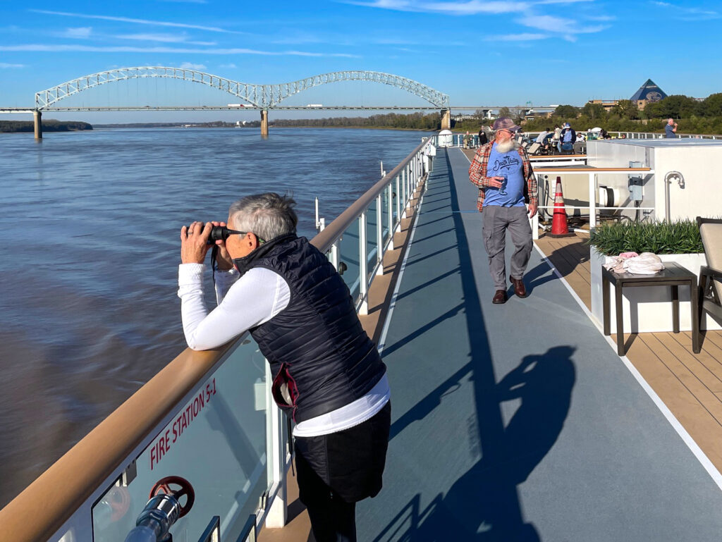 people on the deck of a ship on a cruise on the Mississippi