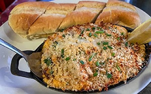 blue crab dip on a skillet