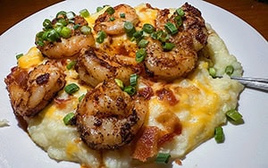 Shrimp and grits on a white plate